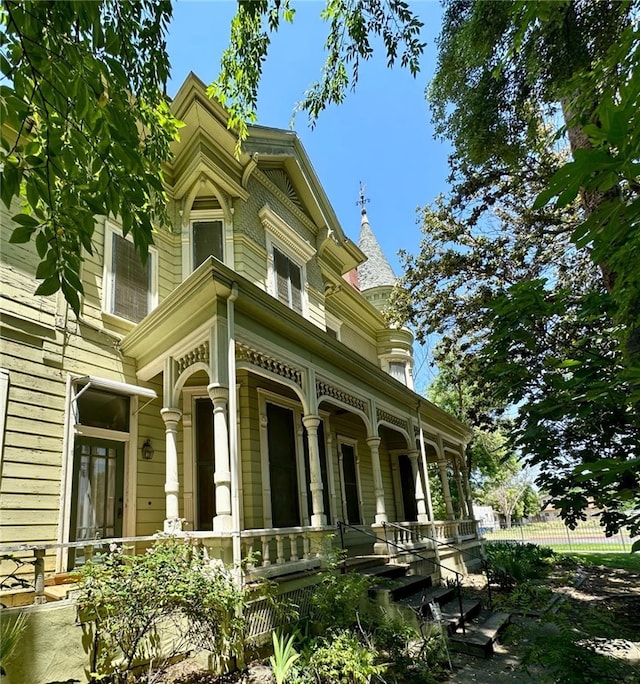 view of side of home with a porch