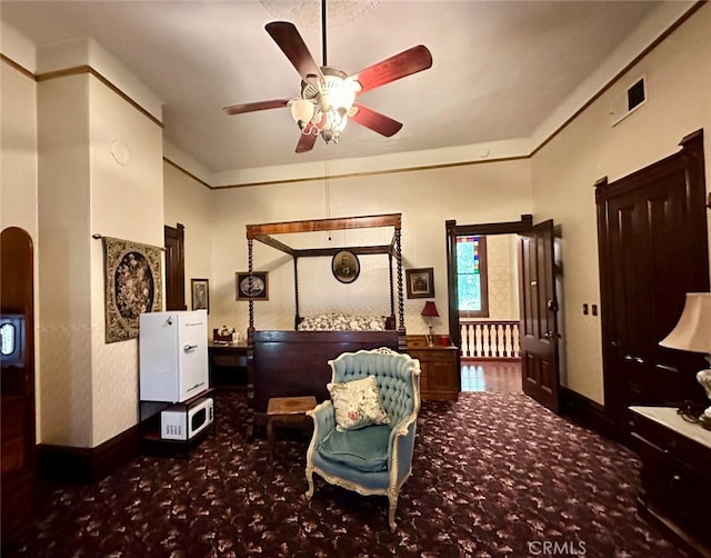 interior space with ceiling fan