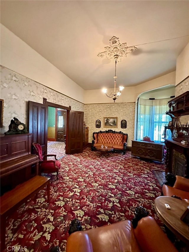 living room featuring carpet floors and a notable chandelier