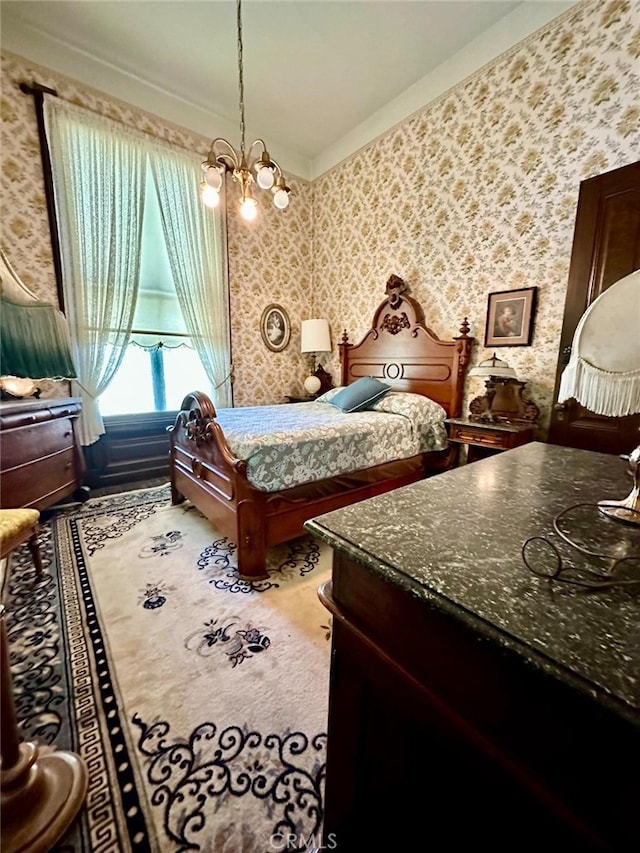 bedroom with an inviting chandelier