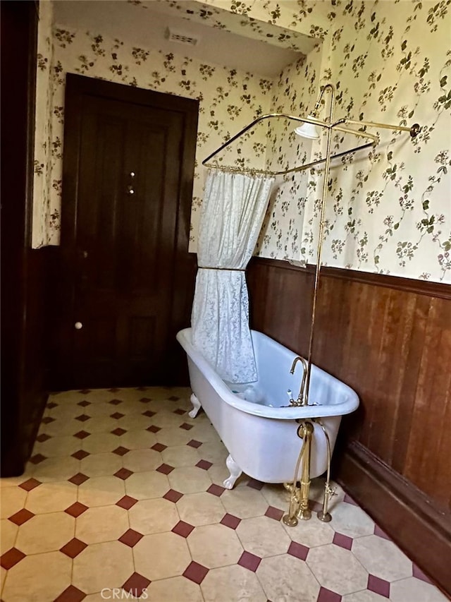 bathroom featuring a tub to relax in