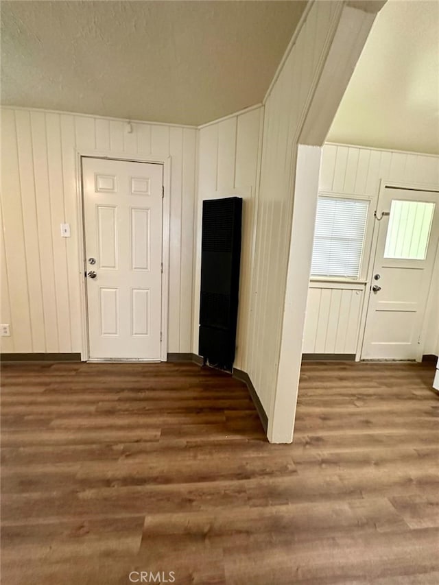 interior space with dark hardwood / wood-style flooring