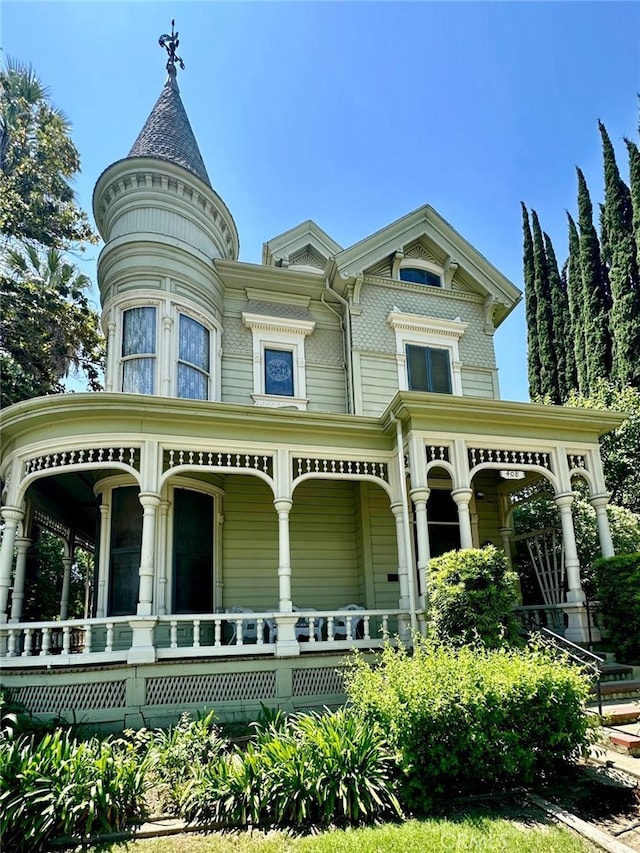 back of property featuring a porch