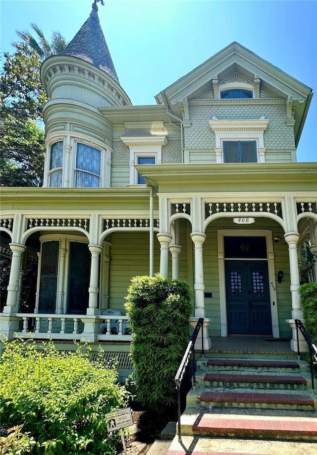 victorian-style house with a porch