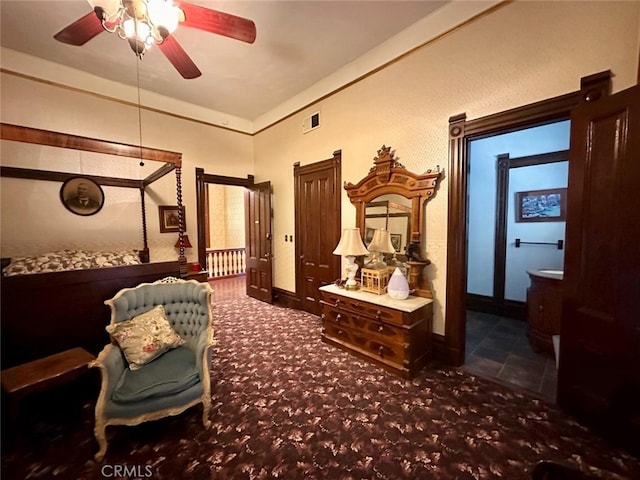 living area featuring dark colored carpet and ceiling fan