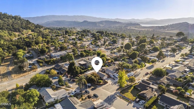 birds eye view of property with a mountain view