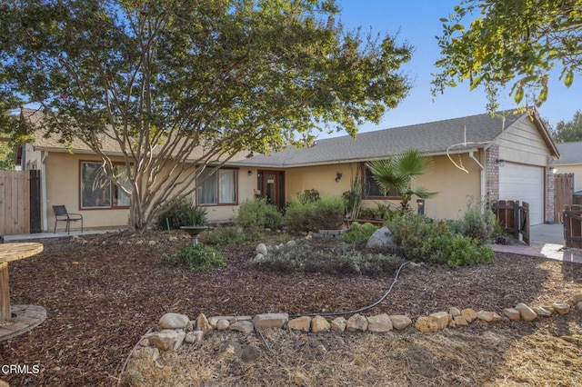 single story home with a garage