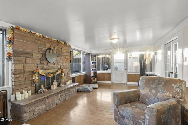 sunroom with a stone fireplace