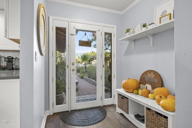 entryway with crown molding and dark wood-type flooring