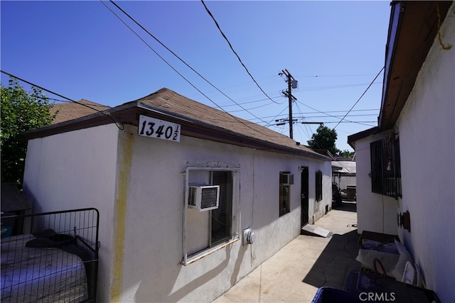 view of side of property with a patio area