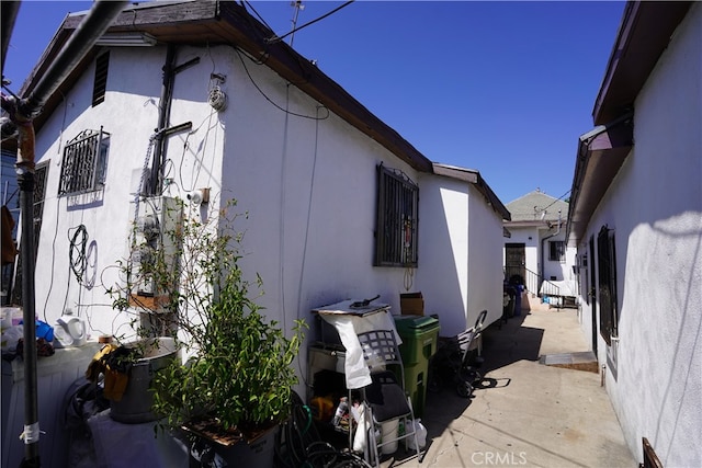 view of property exterior with a patio