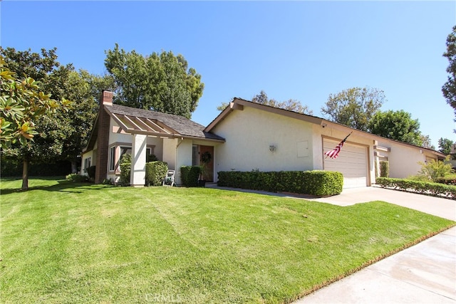 view of front of house featuring a front yard and a garage