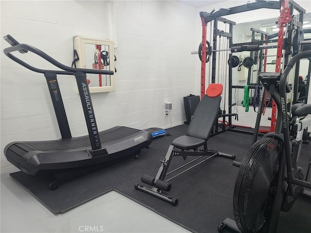 exercise area with concrete block wall