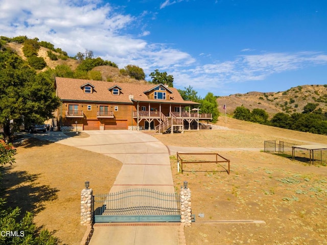 view of front of property with a porch and a mountain view