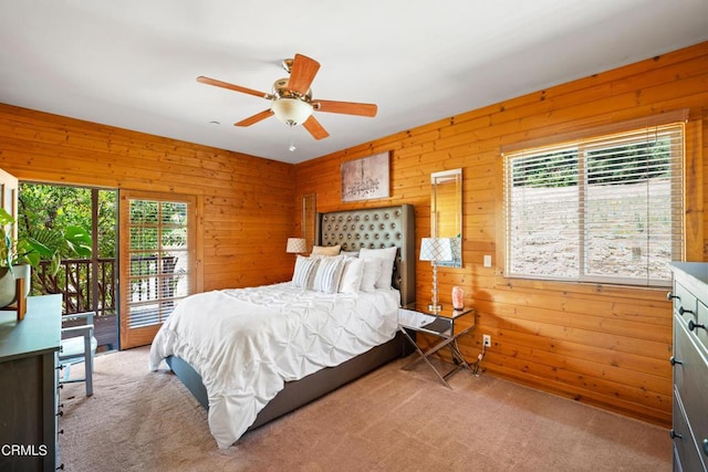 bedroom with ceiling fan, light colored carpet, access to outside, and multiple windows