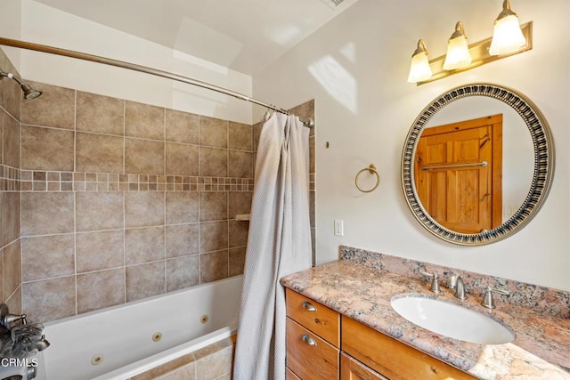 bathroom featuring vanity and shower / bath combo with shower curtain