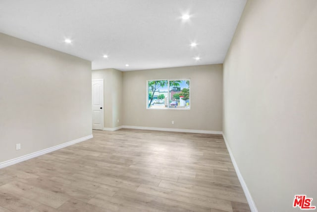 unfurnished room featuring light wood-type flooring