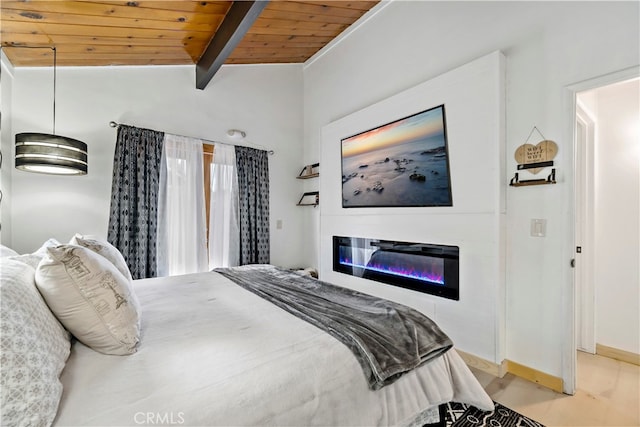 bedroom with vaulted ceiling with beams and wooden ceiling