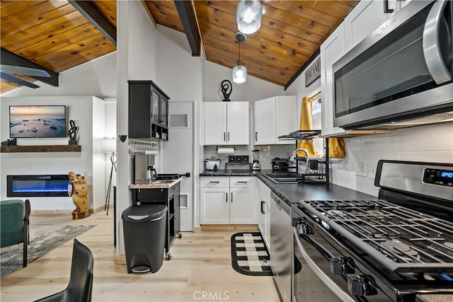 kitchen featuring white cabinets, sink, light hardwood / wood-style flooring, high vaulted ceiling, and stainless steel appliances