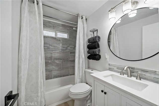 full bathroom with shower / tub combo with curtain, vanity, tasteful backsplash, and toilet