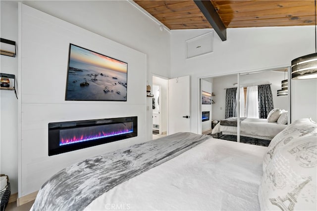 bedroom featuring wood ceiling, a closet, beamed ceiling, and high vaulted ceiling