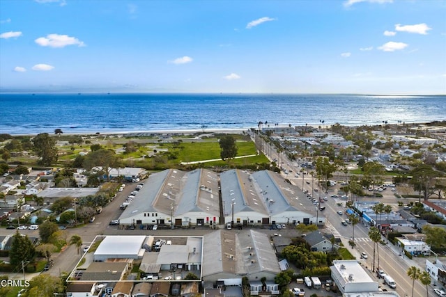 bird's eye view featuring a view of the beach and a water view