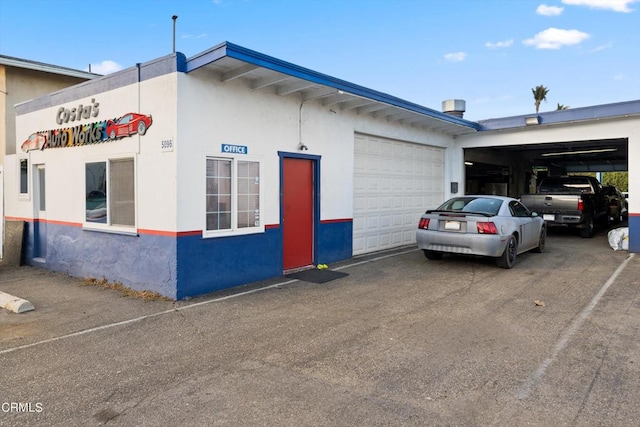 view of side of property with a garage