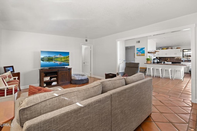 living room with light tile patterned flooring