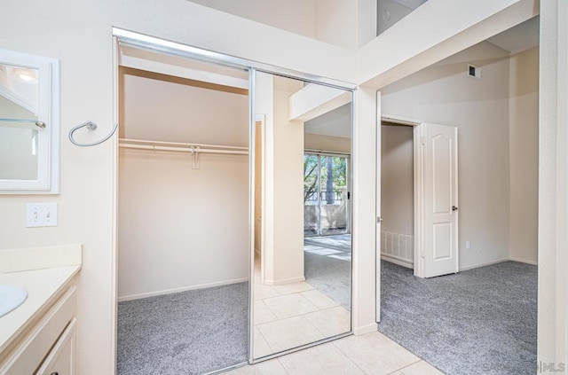 bathroom featuring tile patterned floors and vanity