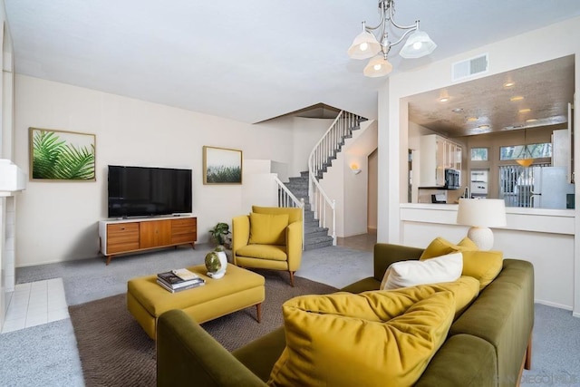 living room featuring a notable chandelier