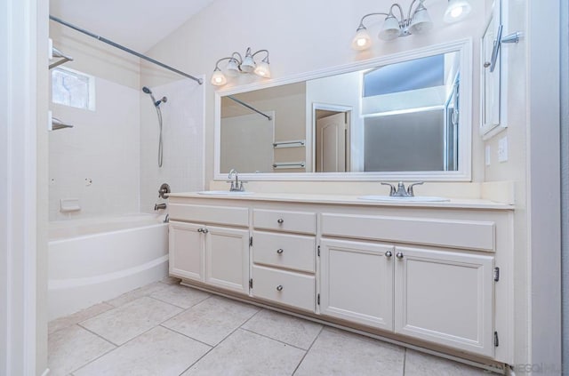 bathroom with tile patterned floors, tiled shower / bath combo, and vanity