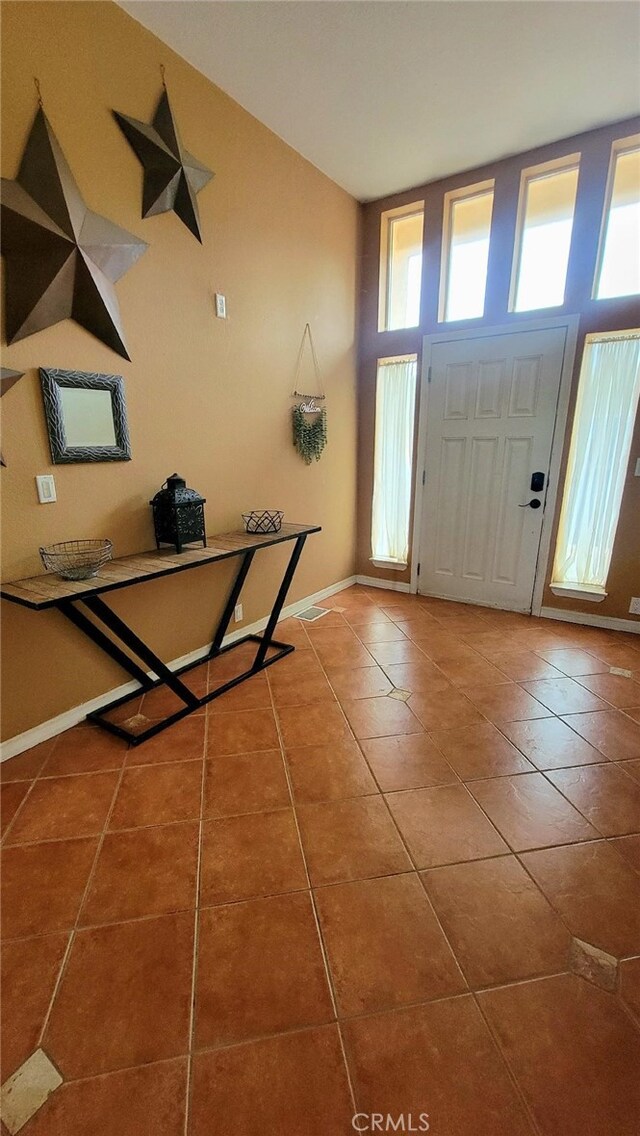 entrance foyer featuring tile patterned flooring