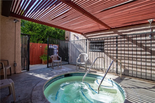 view of pool with an in ground hot tub and a pergola