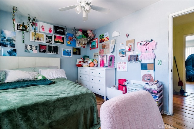 bedroom featuring ceiling fan and wood-type flooring