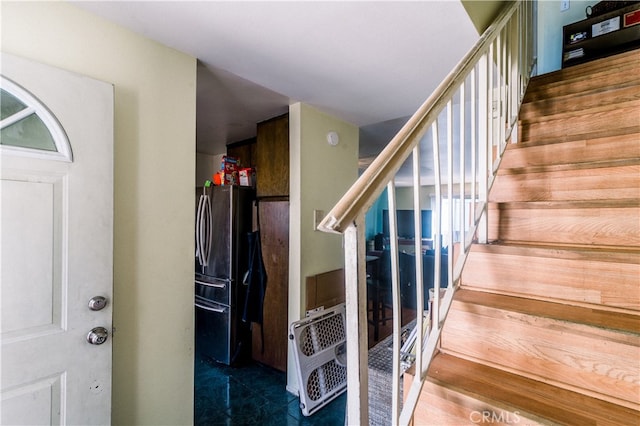 stairs featuring hardwood / wood-style flooring