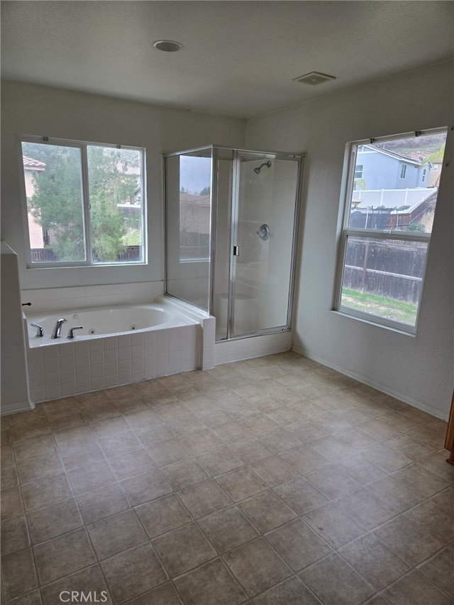 full bathroom with a whirlpool tub, a stall shower, and visible vents