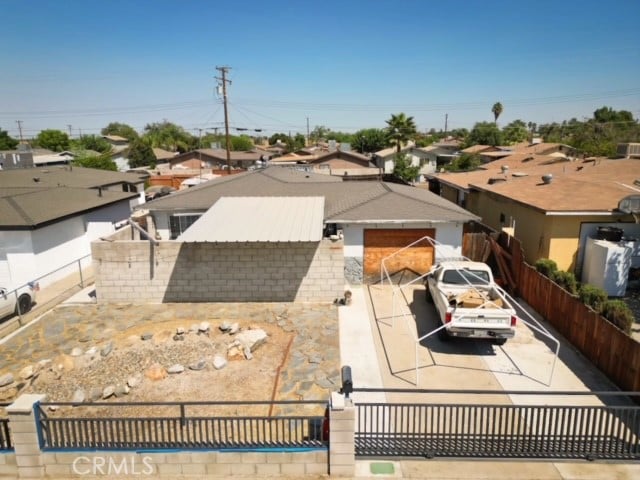 rear view of property with a garage