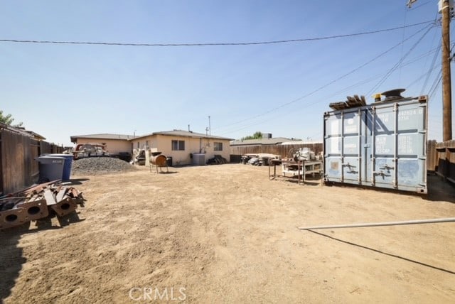 view of yard with a storage unit