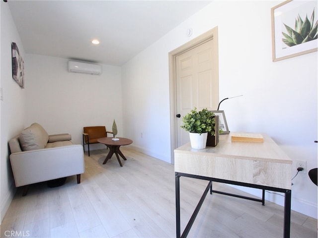 office featuring hardwood / wood-style floors and a wall unit AC