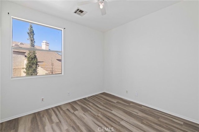 unfurnished room with ceiling fan and wood-type flooring