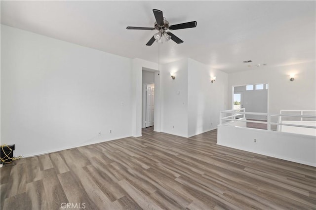 spare room with ceiling fan and hardwood / wood-style floors