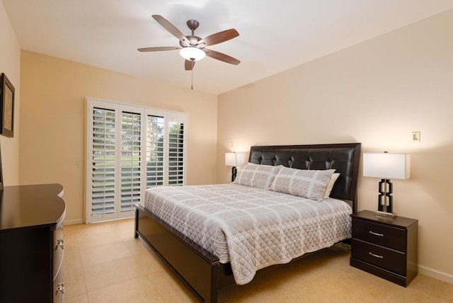 bedroom with ceiling fan and light tile patterned floors