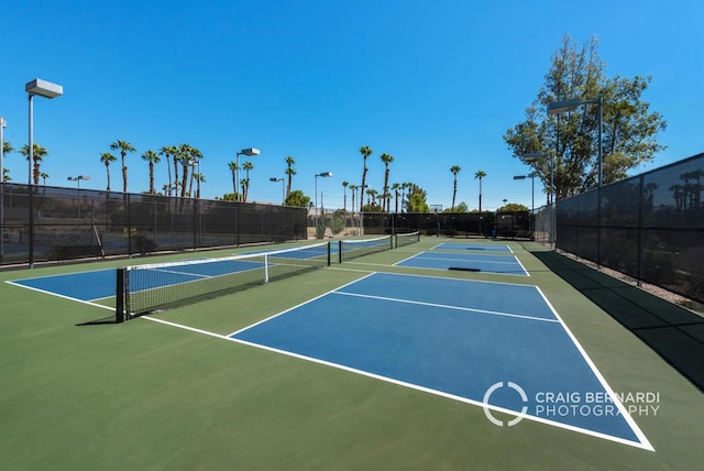 view of sport court with basketball hoop