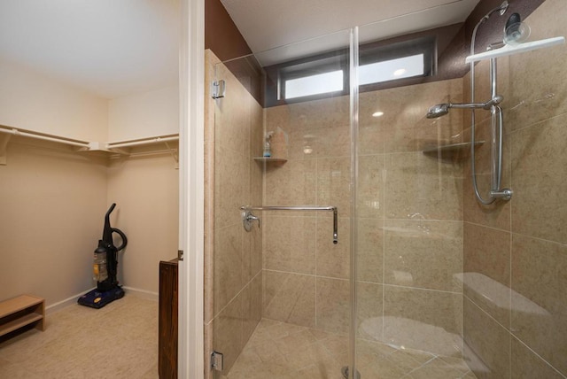 bathroom with a shower with shower door