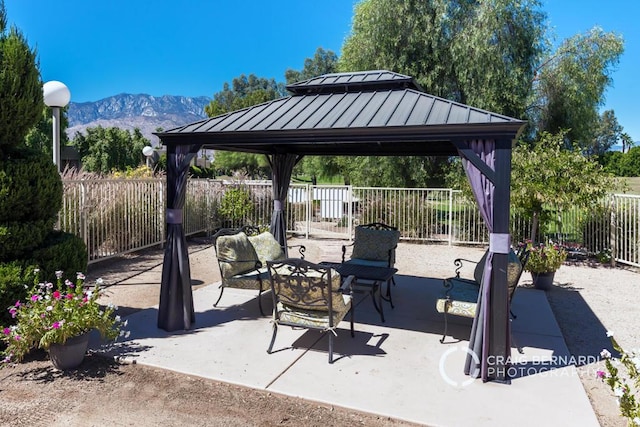 view of patio / terrace featuring a mountain view, a gazebo, and outdoor lounge area