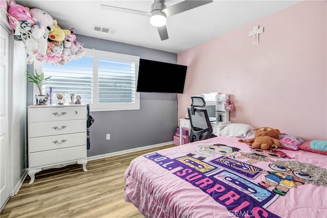 bedroom featuring ceiling fan and light hardwood / wood-style floors