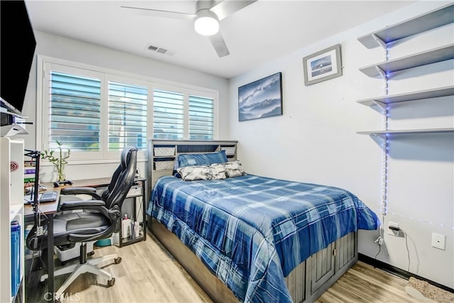 bedroom with light wood-type flooring and ceiling fan