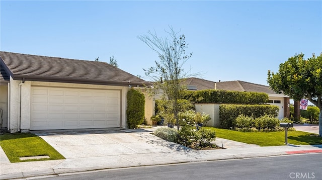 ranch-style home featuring a garage