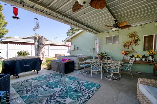 view of patio with area for grilling and ceiling fan