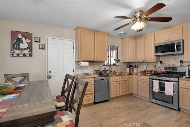 kitchen with ceiling fan, light brown cabinets, dishwasher, light hardwood / wood-style floors, and decorative backsplash